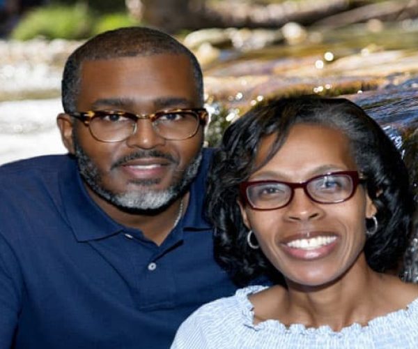 Pastor-Gregory-and-Wife-with-River-Water-running